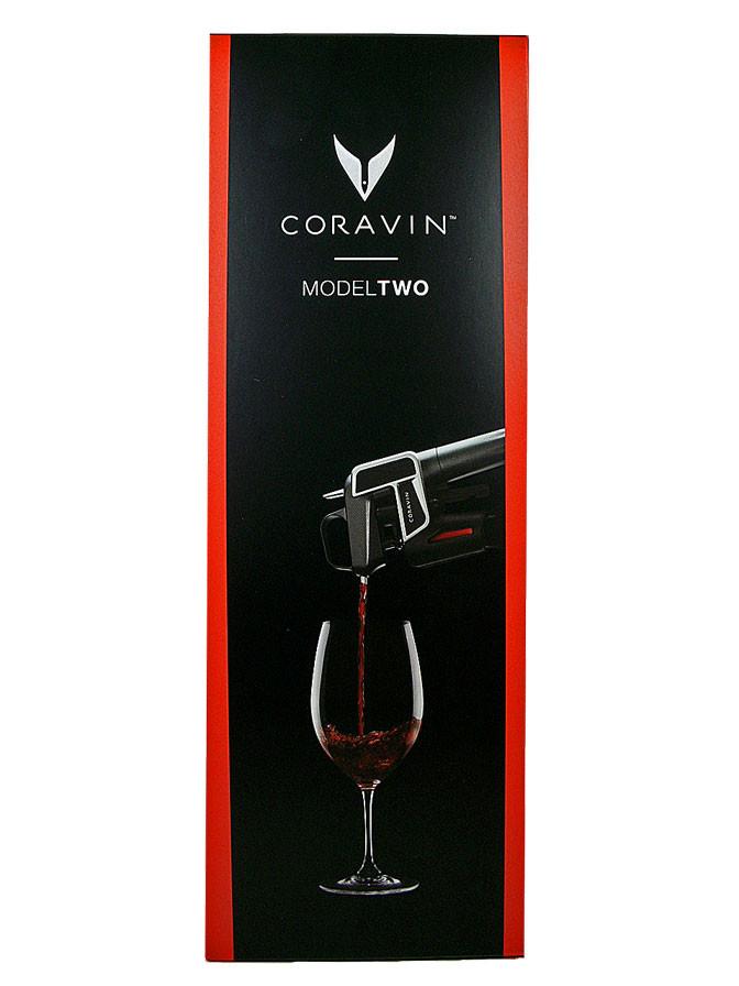 Coravin Model Two retail box with crimson spine and pour photography on black
