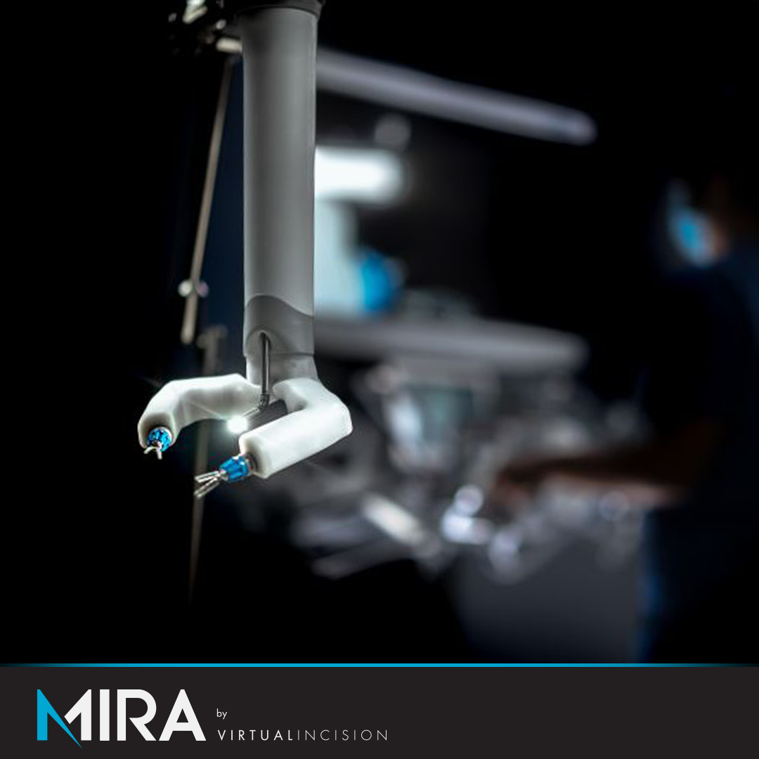 Close-up of the MIRA gripper in a darkened operating room with the MIRA by Virtual Incision lockup